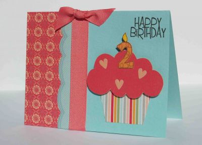 Happy Birthday cupcake (2)
I used Stephanie's cupcake stamp from HappyBday2You, but I stamped it on the BACK of the patterned papers, so the outlines wouldn't show.  Then I embellished it with sticker hearts, and added a cute number 2 candle.
Keywords: numbers4cake