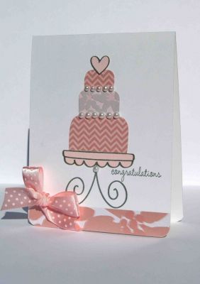 shiny pink cake
 I thought the ink lines outlining my cake layers would be distracting from the overall look of my card, so I stamped the cake on the BACK of the patterned paper, and cut them out.  (You could also just trim on the inside of your lines.)  

