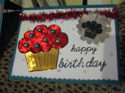 Shiny Sparkly Birthday
Couldn't resist using some thick colored foils to create a happy cupcake. Teal blue and gold "sprinkles" reflect the red icing, and match the teal carstock. The red sparkly garland "ribbon" makes this likely the shimmery-est card I've ever made! Love this stamp set! 
