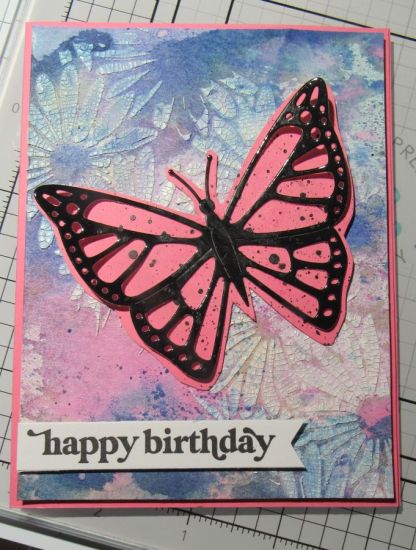 Beautiful Butterfly Birthday
I made a watercolor background and layered it with crackle paste through a floral stencil.  Then I cut the butterfly from the Beautiful Butterfly Flip-it card because I liked the size and flicked black paint on it to "dumb down" the bright pink that I fussy cut out.
