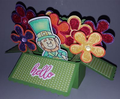 A quick "thinking of you" card (that saying is hidden by the flowers).  Flowers were all colored with stickels glitter glue.
Keywords: box flowers glitter hello leprechaun