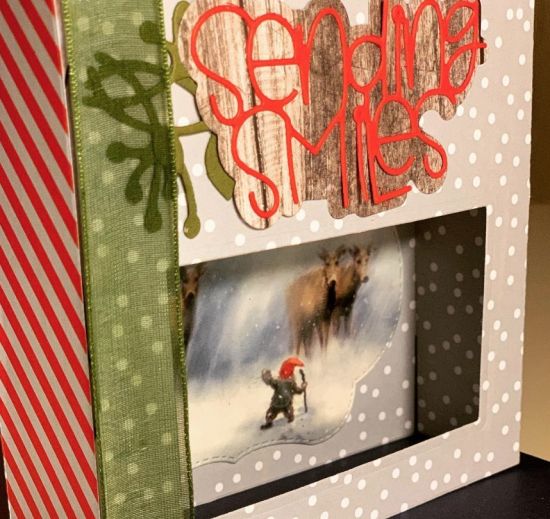 sending smiles christmas box card
I saw bits of cool stuff from magazines and sometimes incorporate. The scene in the interior of the shadow box and the woodgrain are such. The scene is so cool. Got an international phone call of thank you for this one. :) 
Keywords: christmas shadow box A2