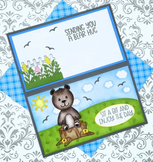 Daytime Mini Slimline background
Keywords: Bear tree stump birds clouds sun flowers fence